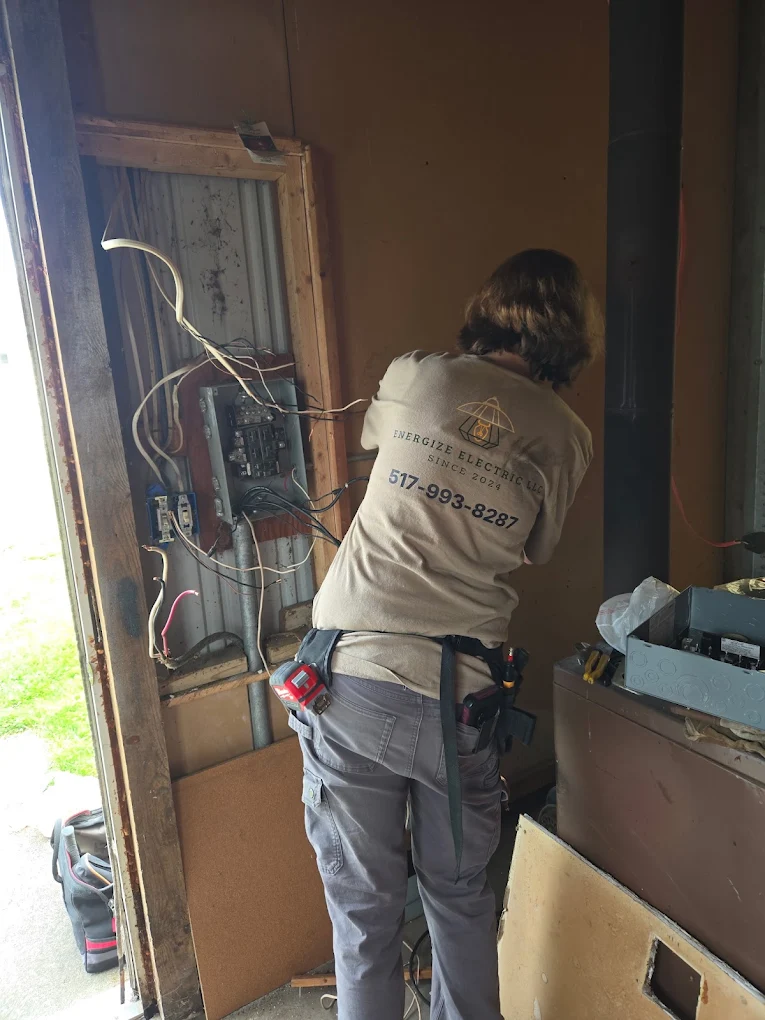 Energize Electric electrician working on a residential panel